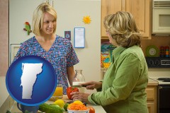 vermont map icon and a nutritionist discussing food choices with client