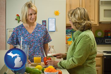a nutritionist discussing food choices with client - with Michigan icon